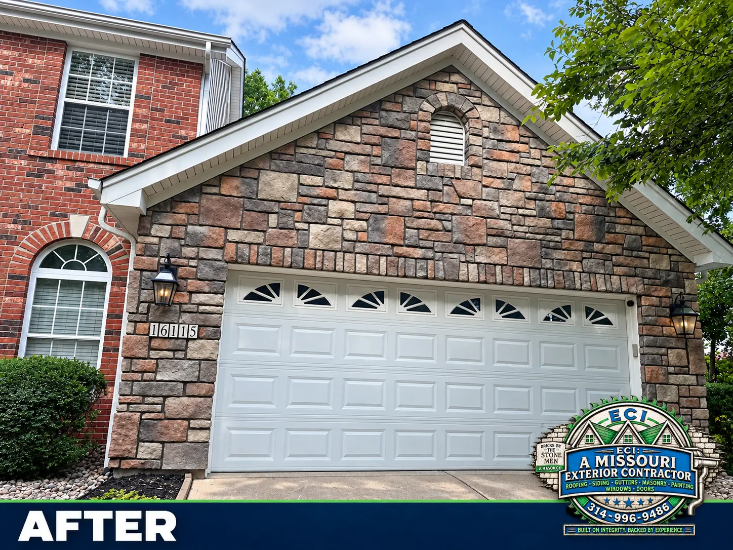 Completed stone-clad garage front with brick home visible alongside