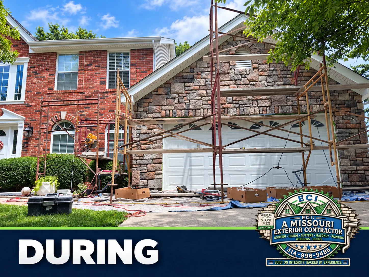 Scaffolding and materials around the garage as stone masonry takes shape